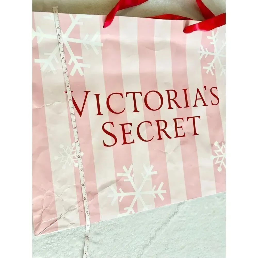 Victoria’s Secret large holiday light pink and red gift bag tote with snowflakes